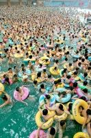 Cartoon\OverPopulation: Thousands-of-swimmers-crowded-into-a-pool-in-penglai-in-sichuan-western-china